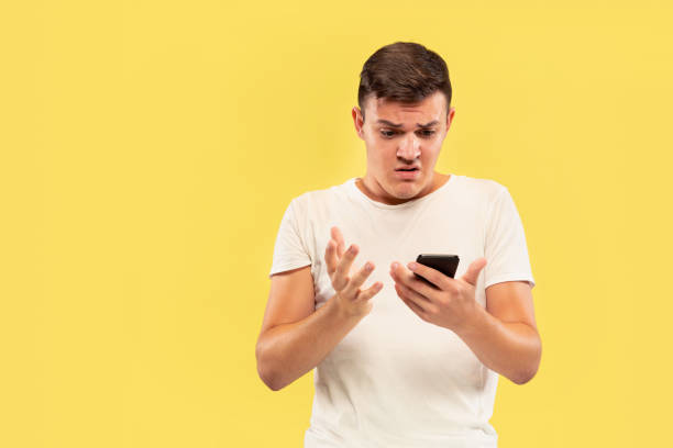 istock Caucasian young man's half-length portrait on yellow background 1178020705