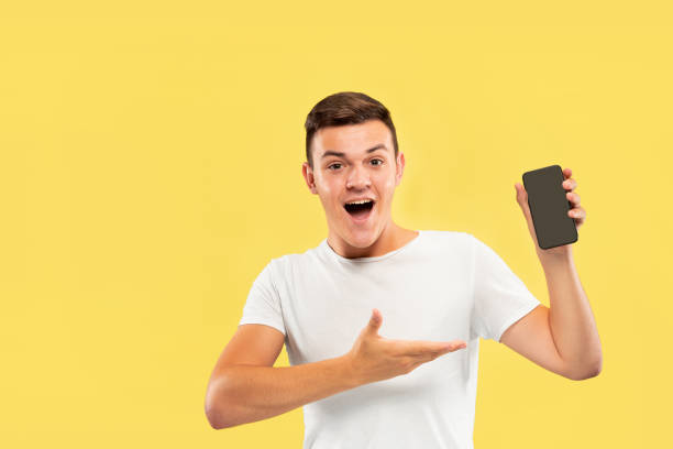 istock Caucasian young man's half-length portrait on yellow background 1178020718