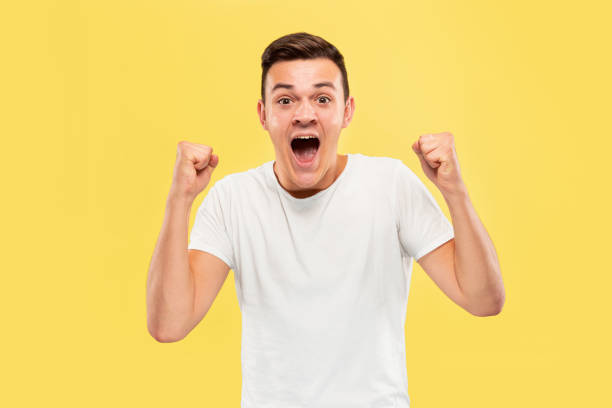 istock Caucasian young man's half-length portrait on yellow background 1178020775