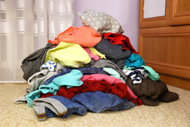 istock Pile of carelessly scattered clothes on floor. 1178021364