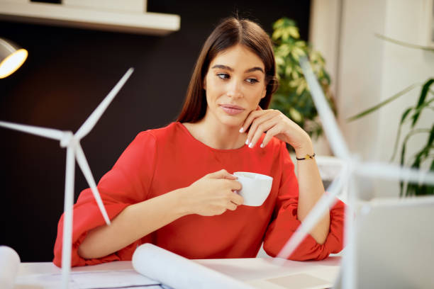istock Woman drinking coffee in office. 1178023856
