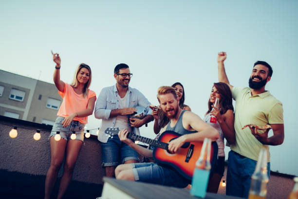 istock Having a great time with friends, havinf fun at rooftop party 1178024324