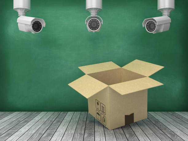 istock Cardboard Box with Security Cameras on Wood Floor - Chalkboard Background - 3D Rendering 1178024368