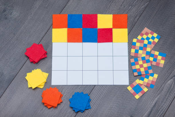 istock Kids education game at home. Colored textile squares put as same as in sample. 1178034942