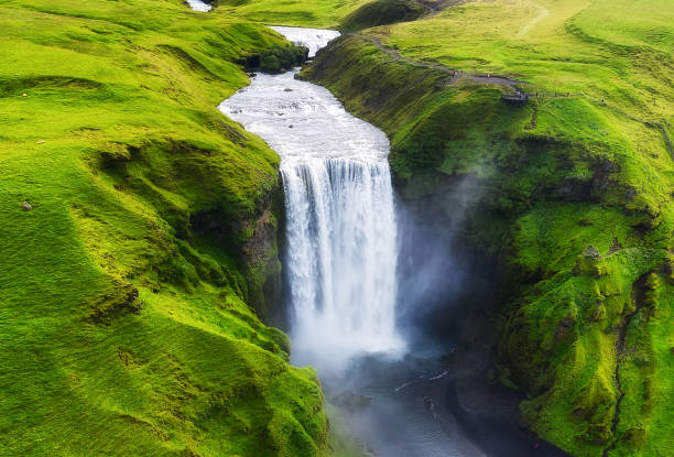 Aerial view on the Skogafoss waterfall in Iceland. Landscape from air. Famous place in Iceland. Travel - image Aerial view on the Skogafoss waterfall in Iceland. Landscape from air. Famous place in Iceland. Travel - image skogafoss stock pictures, royalty-free photos & images