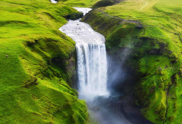 aerial view on the skogafoss waterfall in iceland. landscape from air. famous place in iceland. travel - image - cachoeira imagens e fotografias de stock