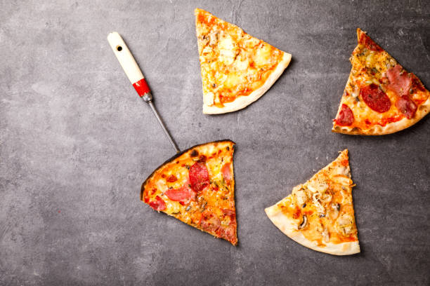 istock Pizza Assortment Pepperoni Salami Bacon Tomatoes  Mozzarella  Four Cheese on  stone Background Bake Spicy Snack Top View Copy space for Text 1178037102