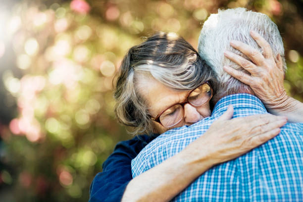 istock Senior couple embracing in garden 1178037154