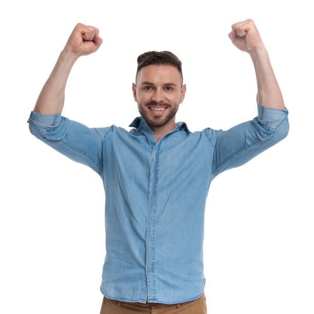istock casual man standing with hands up happy 1178037882