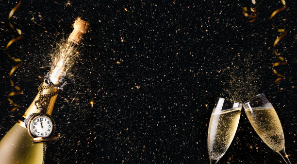 New year celebration party with champagne bottle and glasses toasting - fotografia de stock