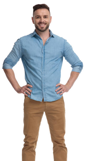 istock casual man standing with hands on waist confident 1178038374
