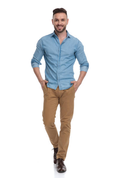 istock casual man walking with hands in pockets happy 1178038401
