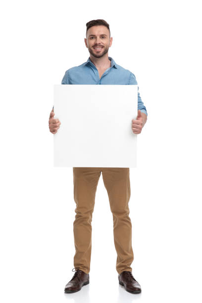 istock casual man standing with billboard on hands happy 1178038462