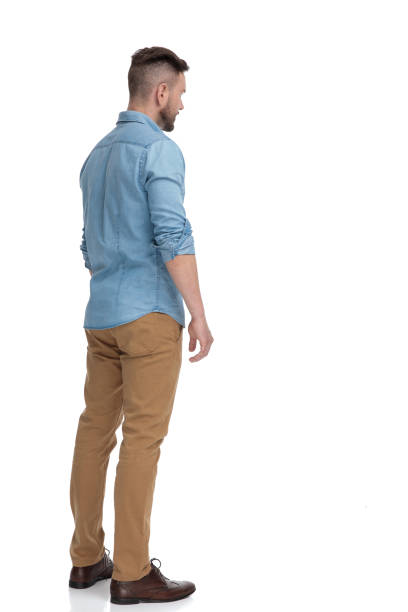 istock casual man standing and looking away pensive 1178038486
