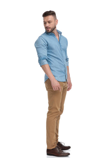 istock casual man looking back over the shoulder pensive 1178038555