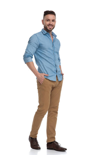 istock casual man walking with hands in pockets joyful 1178038613