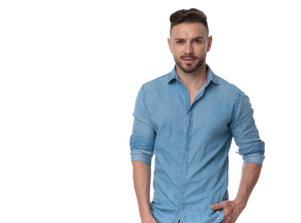 istock casual man standing with hands in pockets serious 1178039367