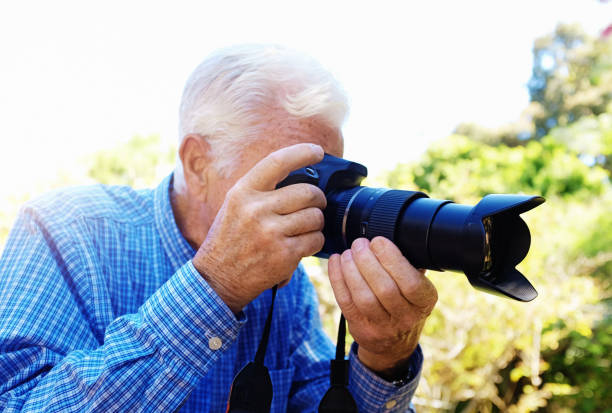 istock Senior man taking photograph 1178039529