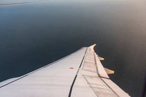 Close up Airplane window with airplane wing