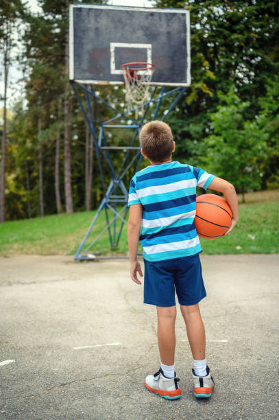 istock Young boy playing basketball 1178041777