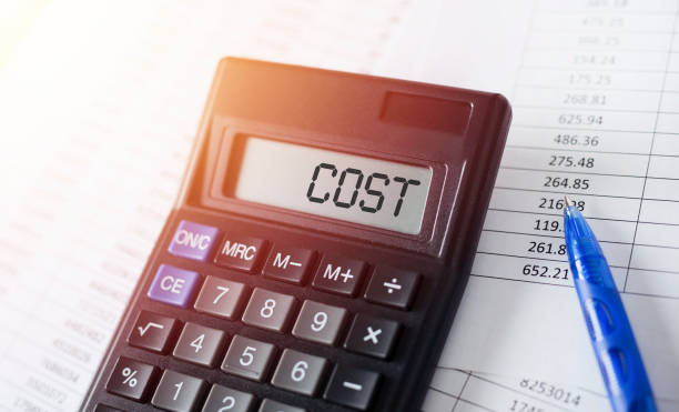 istock Word Cost on calculator. Costs optimization business concept. 1178042010