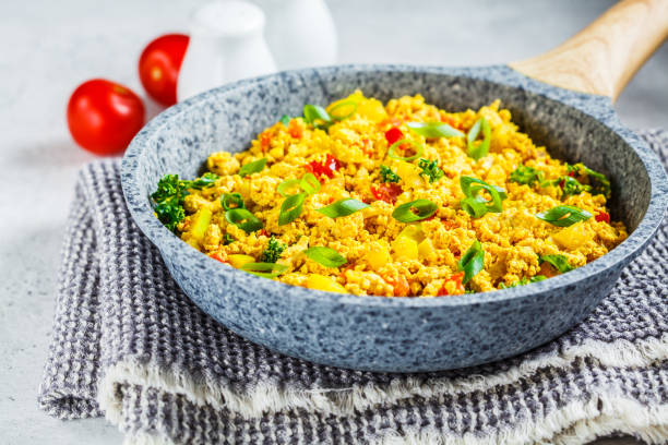 istock Tofu scramble with vegetables in a pan. Vegan Alternative Omelet. 1178043063
