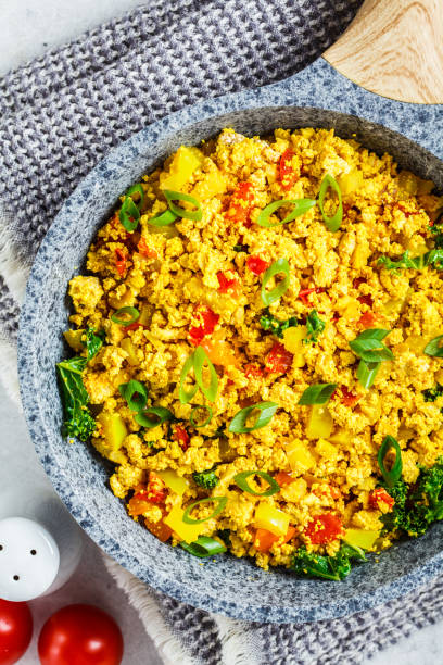 istock Tofu scramble with vegetables in a pan. Vegan Alternative Omelet. 1178043109