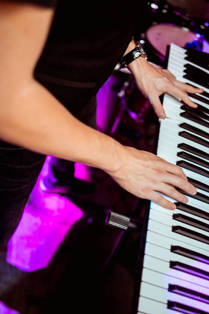 playing the synthesizer concert, hands on the keys