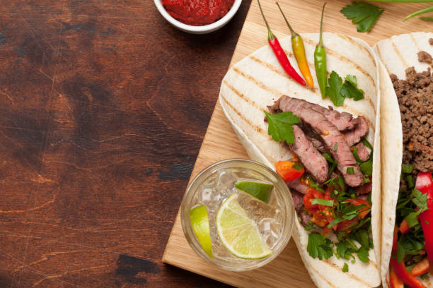 istock Mexican tacos and caipirinha cocktail 1178044618