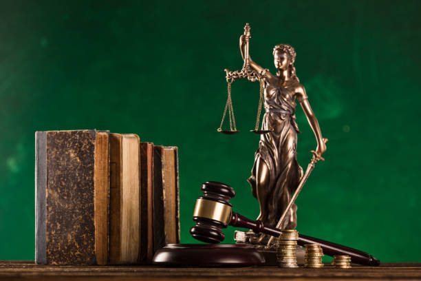 istock brown gavel with statue of justice. 1178046025