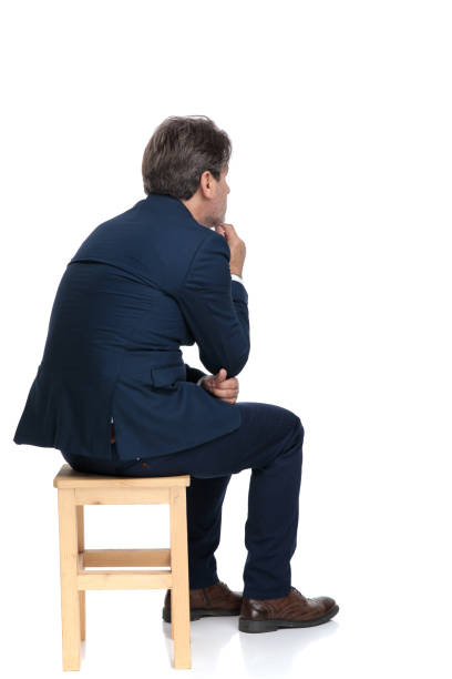 istock businessman sitting touching his chin pensive 1178046052