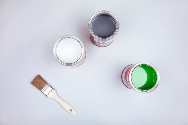 istock Paint brushes placed on top of can filled with green paint 1178048085