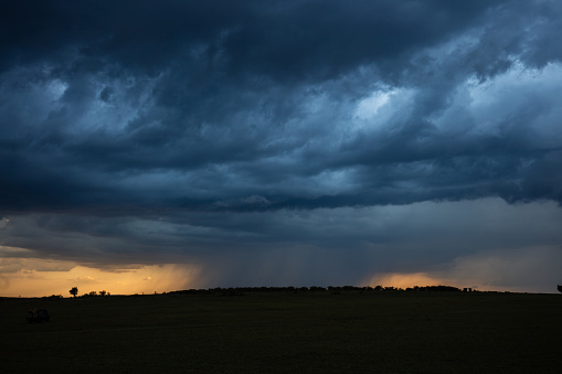 Majestic storm clouds in Masai Mara, Kenya. Copy space.