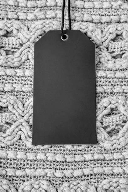 istock Black price tag on gray wool knitwear 1178049001