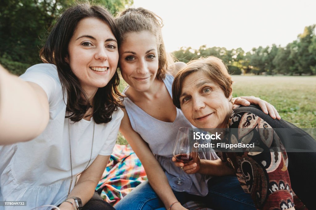 Mother doing a selfie with her daughters Adult Stock Photo