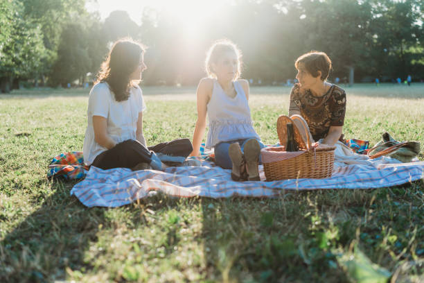 istock Mother and daughters at the park together 1178049842