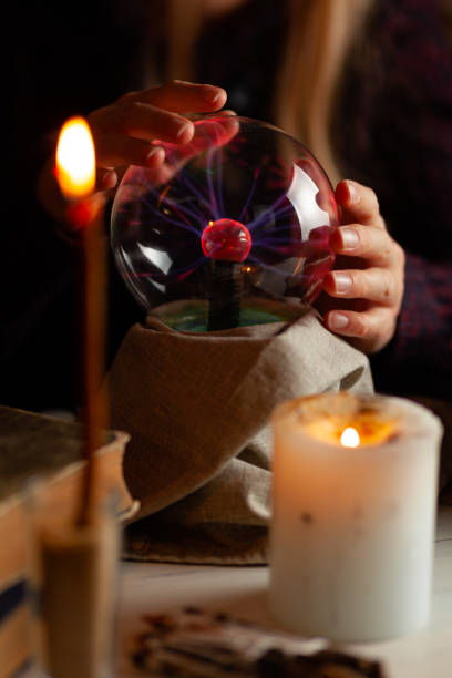 istock Seer with magic ball performs ritual. Psychic vision, fortune teller 1178050757
