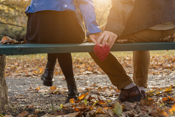 istock Couple in the park enjoying nice autumn time. 1178055945