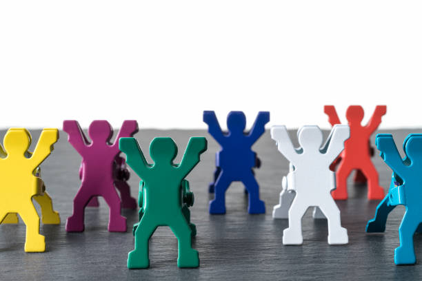 istock Colorful diverse miniature people figurines standing in a row. 1178059327