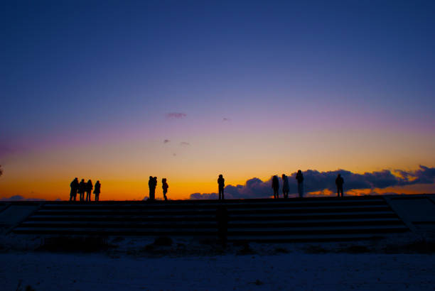 People and sunrise stand on breakwater. Shooting Location: Sendai, Miyagi Prefecture