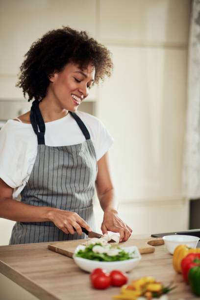 istock Mixed race woman chopping mushrooms. 1178068981