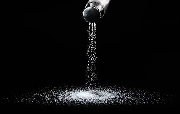 Photo of Salt shaker on a dark background