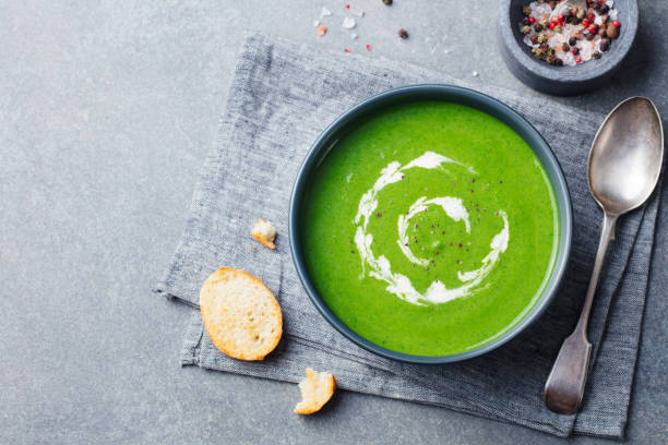 istock Spinach soup with cream in a bowl. Grey stone background. Copy space. Top view. 1178070360
