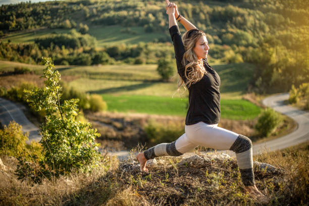 istock Young woman doing yoga in nature 1178070749