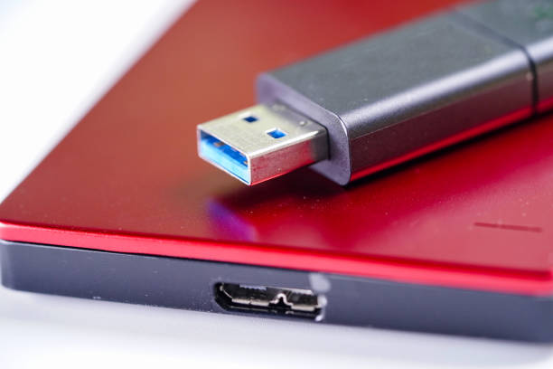 istock Red external hard disk with USB thumb drive isolated on white background. 1178070779