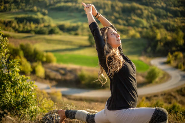 istock Young woman doing yoga in nature 1178070857