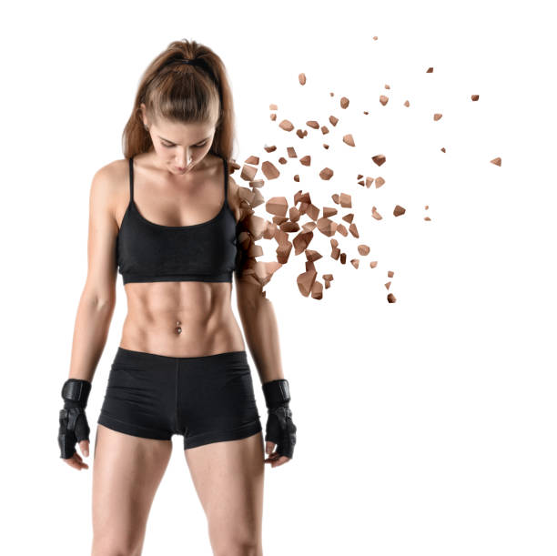 Young fit woman in gym clothes looking down, one arm practically dissolved in particles, isolated on white background. Change your body. Practice makes perfect. Keep fit.