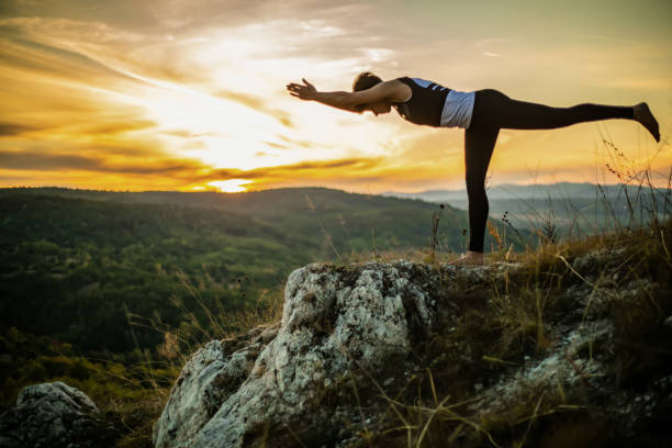 istock Young woman doing yoga in nature 1178074908