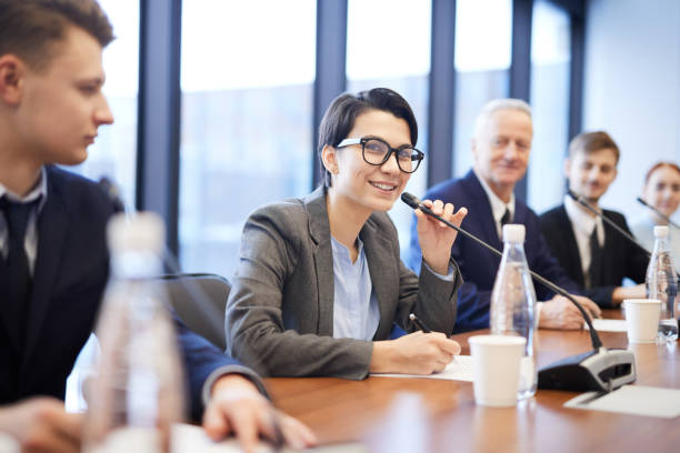 istock Smiling Young Businesswoman Speaking at Conference 1178077217