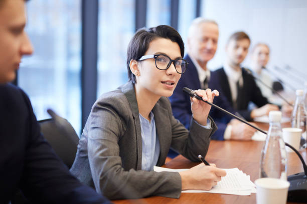istock Young Businesswoman Speaking at Conference 1178077231